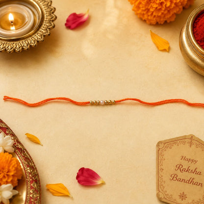 Pulseras | Rakhi with Orange Thread Gold-Tone Beads (€0.50 per unit)